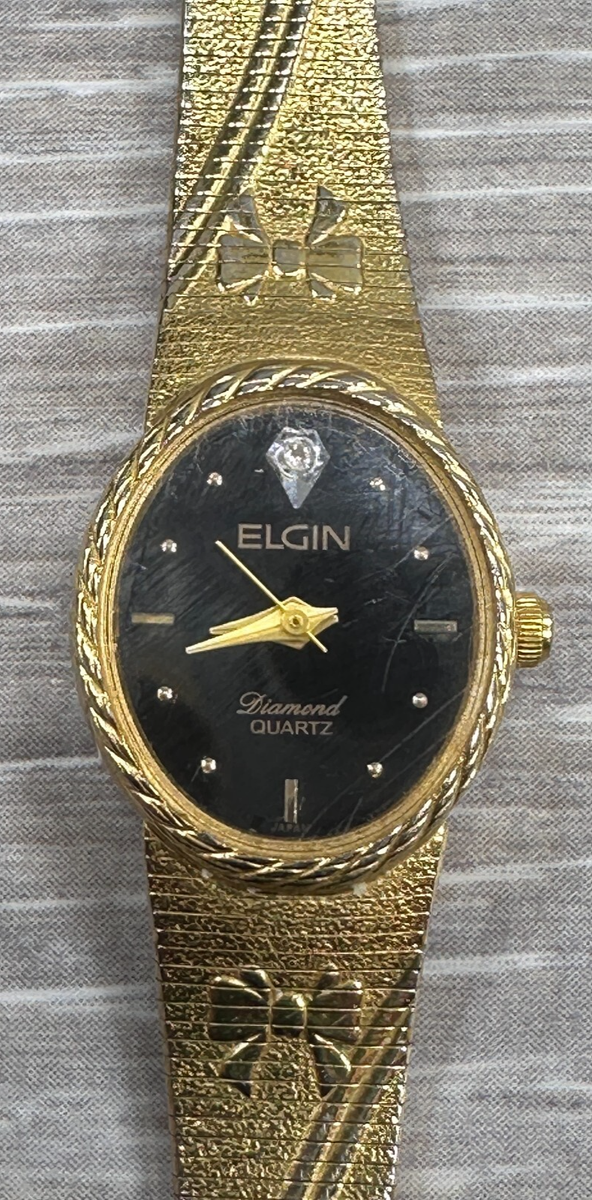 Vintage Elgin Gold Tone, Black Face Woman's Diamond Quartz