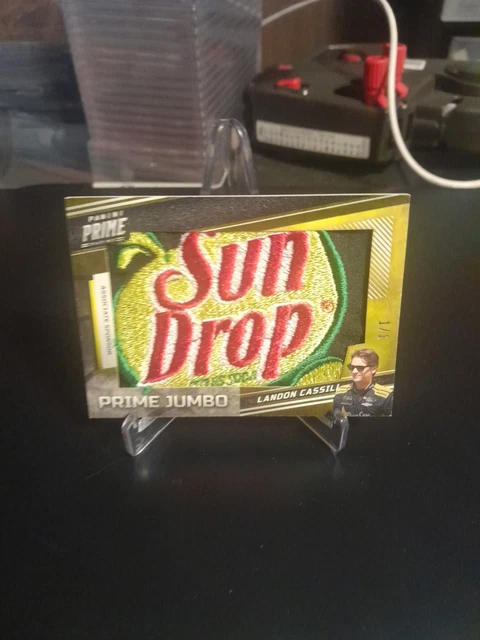 2023 Panini Prime Landon Cassill Race Used Firesuit Sun Drop Logo Patch #D 1/1