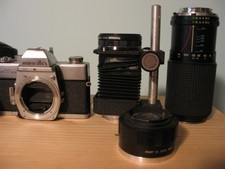 2 Minolta SRT 101 cameras, 5 lenses, case and release