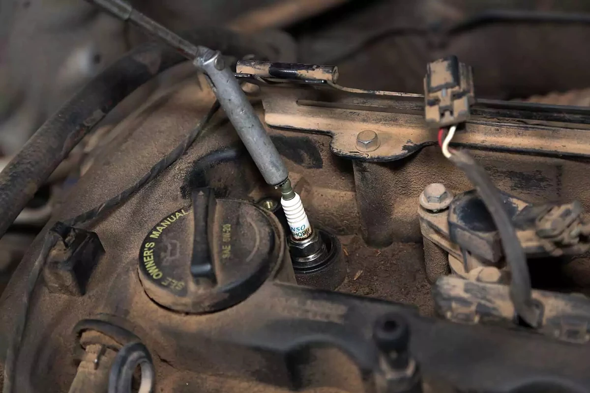 Magnet being used to fish plug out of cylinder head.