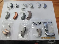 LOT OF 24  HEARING AIDS ALL WITH PROBLEMS FOR PARTS OR REPAIR