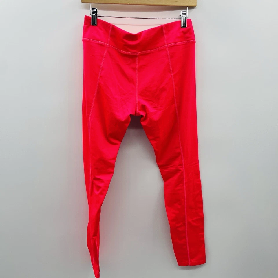 Pantalones al tobillo deportivos forrados de vellón reflectantes talla mediana Hind para mujer en rosa Foto 3 de 4