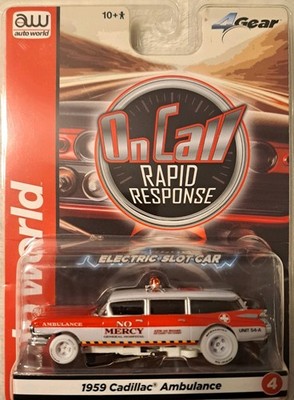  AUTO WORLD 4 GEAR REL 1 ON CALL '59 CADILLAC AMBULANCE  HO SLOT( CHASE ) 