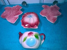 Four Ceramic pots to hang on the wall.Multicolored.