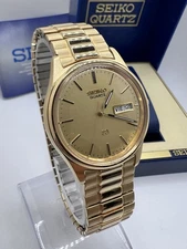 Vintage New Old Stock Seiko SQ Day Date Gold Tone Elegant Sporty Stretch Band