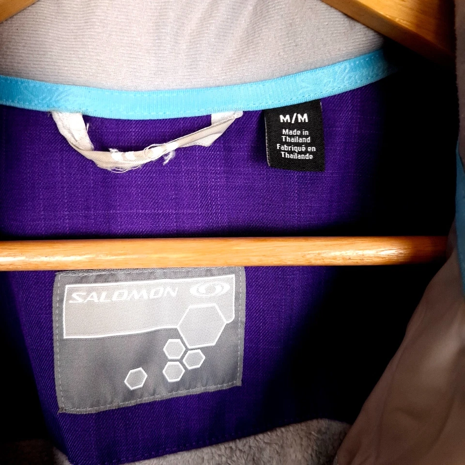 Chaqueta cortavientos para mujer SALOMON talla M púrpura con capucha aislada Foto 4 de 4