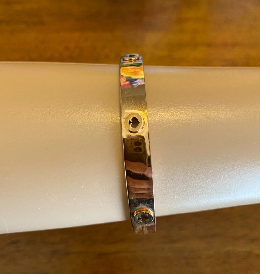 Bracciale Kate Spade "Spot the Vanga" oro rosa con borchie e cerniera