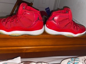 red and white low top 11s