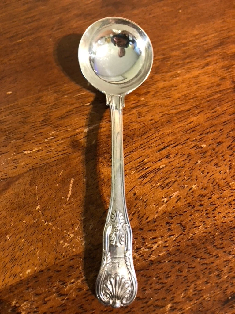 Antique sterling silver ladle. Walking lion England. Beautiful sauce ladle