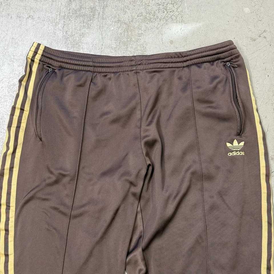 Pantalones deportivos Adidas vintage forrados de lana con cremallera al tobillo para hombre XL nailon marrón amarillo Foto 2 de 4