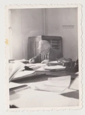 Focused Solitude An Elderly Scholar Immersed in the World of Paperwork Snapshot