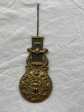 ANCIEN BALANCIER DE PENDULE ANCIENNE FIGURANT UN CHERUBIN