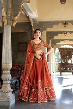 Latest Designer Orange Rangoli Silk Lehenga Choli With Dupatta For Reception