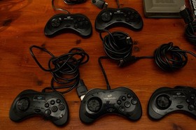 6x mk2 official Sega Saturn controllers, Saturn Bomberman game, & multi-tap