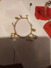 375 YELLOW GOLD 19CM VINTAGE CHARM BRACLET WITH 8 X CHARMS , 5.3.GRAMS..8G
