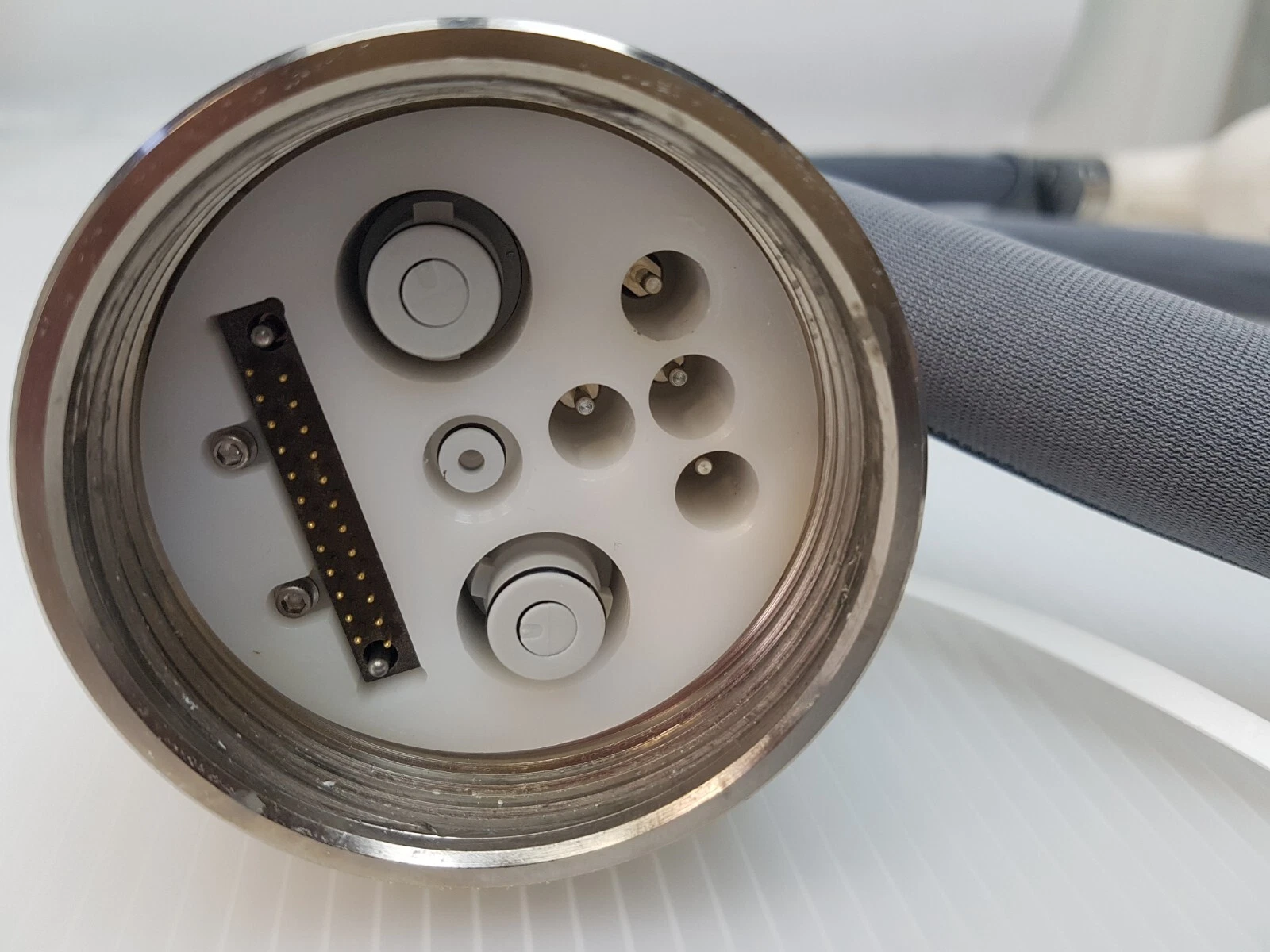 Connector face of the LightSheer handpiece cable with multi-pin connector and ports