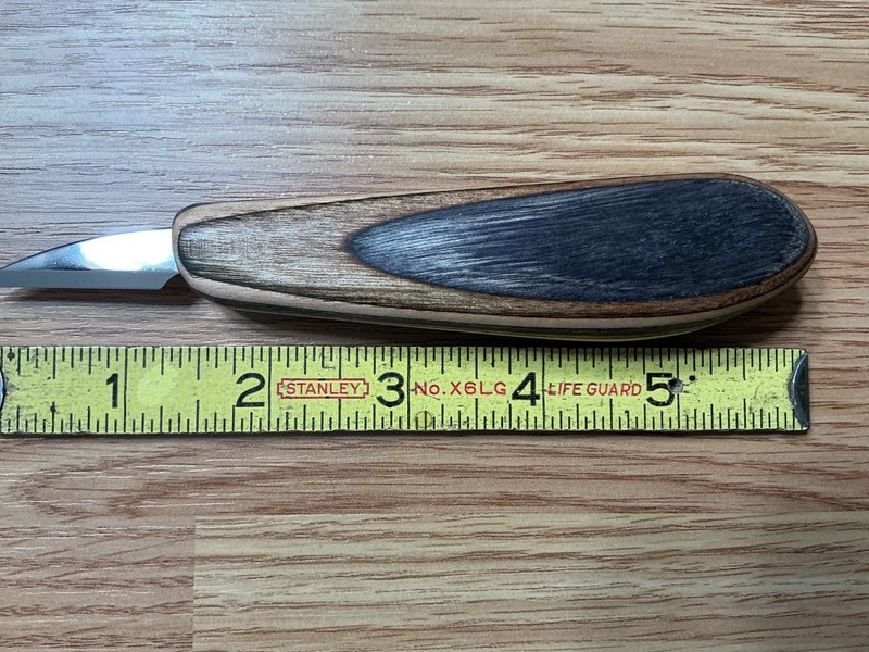 Wood carving knife by Tom Ellis. Spectra ply wood handle.1 1/2” blade.  6” total