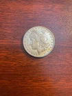 1884-S Morgan $1 – Chest Feathers Variety – AU Circulated