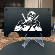 Deadpool Superhero Making a Heart Laser Engraved Onto An Aluminum Wallet