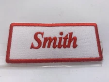 SMITH  NEW EMBROIDERED  SEW / IRON ON NAME PATCH RED ON WHITE
