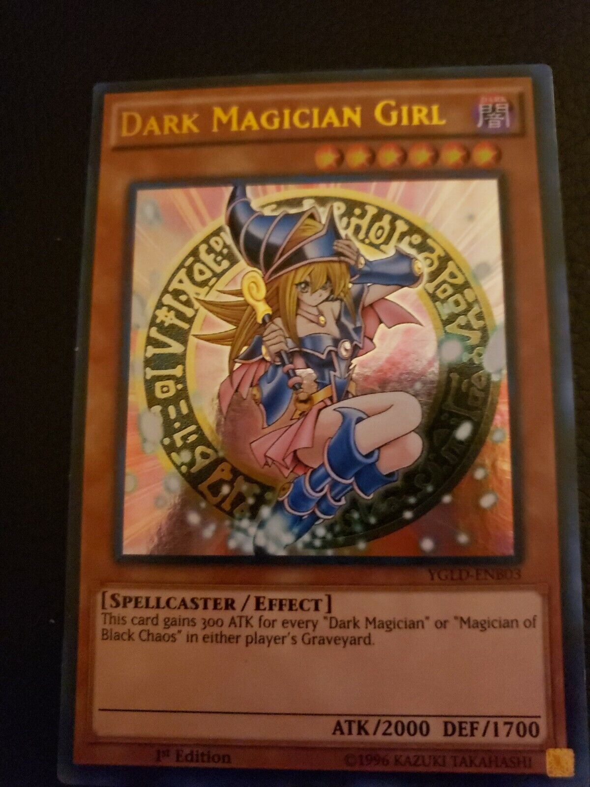 Dark Magician Girl being showcased by the seller.