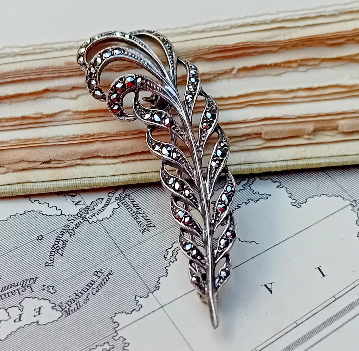 Sterling Silver Feather Brooch set with Marcasite. Stamped SILVER