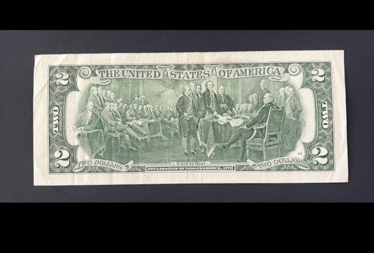 ERROR $2 DLL BILL - OVERINK ON SERIAL #: "3" & WET INK TRANFER ON MARGINS, CIRC.