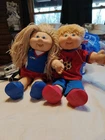 Two cabbage patch dolls.