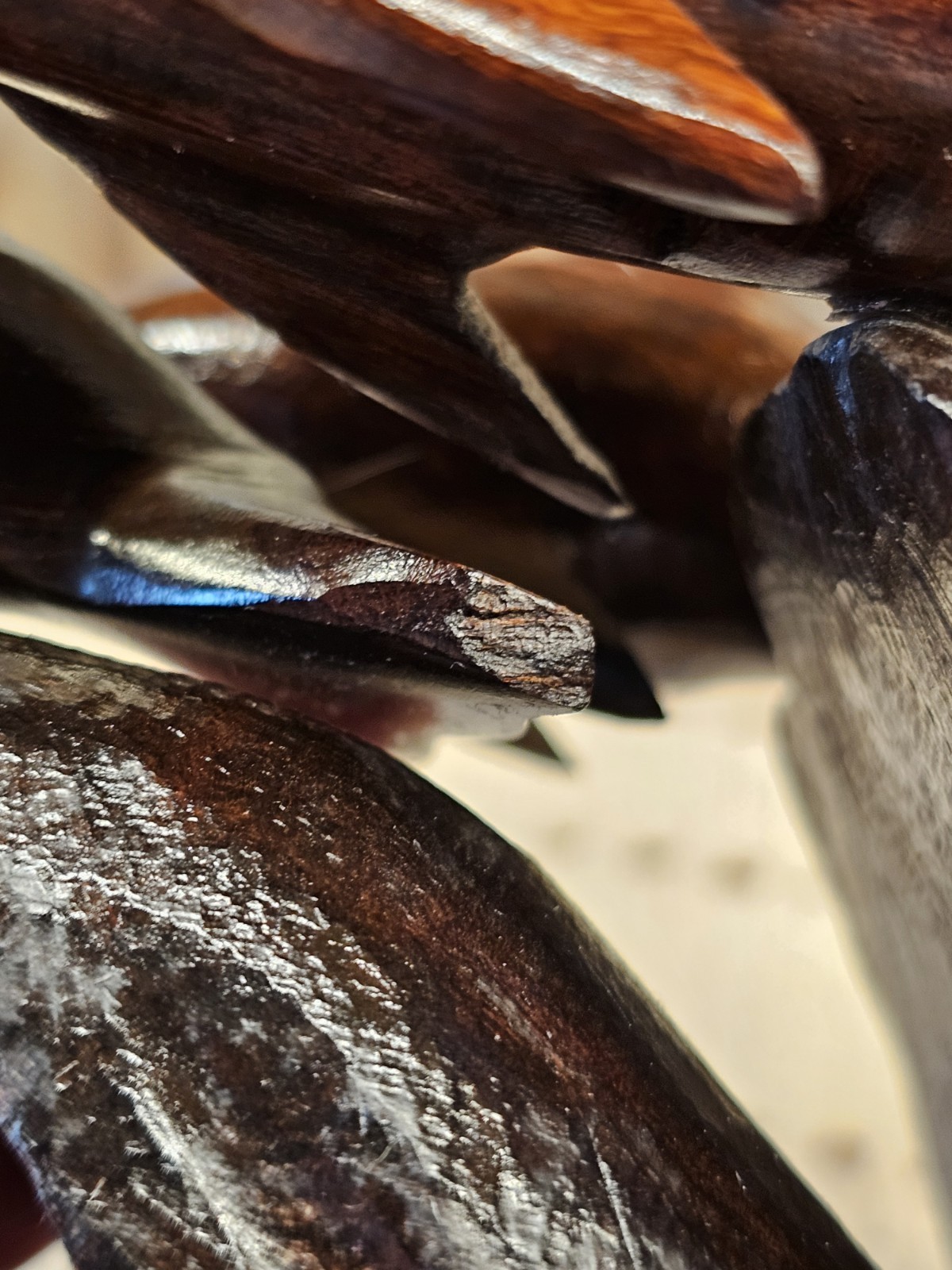 Trio Of Dolfins Riding A Wave, Ironwood Statue