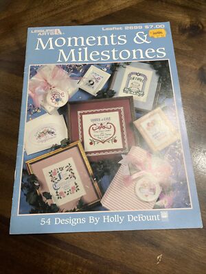 Leisure Arts: MOMENTS & MILESTONE Cross Stitch Leaflet #2699 by Holly De Fount