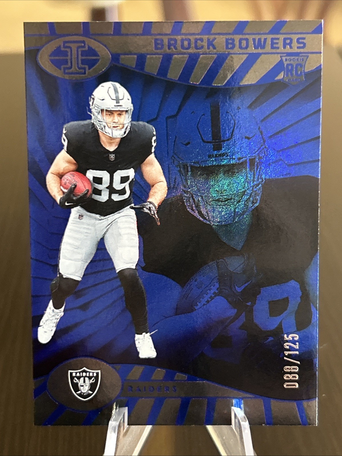 2024 Panini Illusions Trophy Collection Blue #47 Brock Bowers RC /125