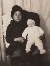 1920s Girl Holding Infant Baby Portrait Indoor Warm Clothing