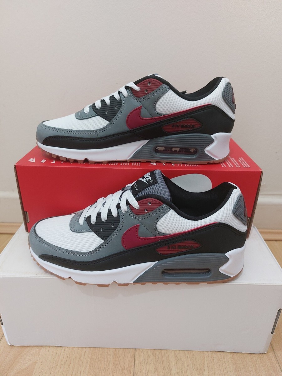 grey and red nike trainers