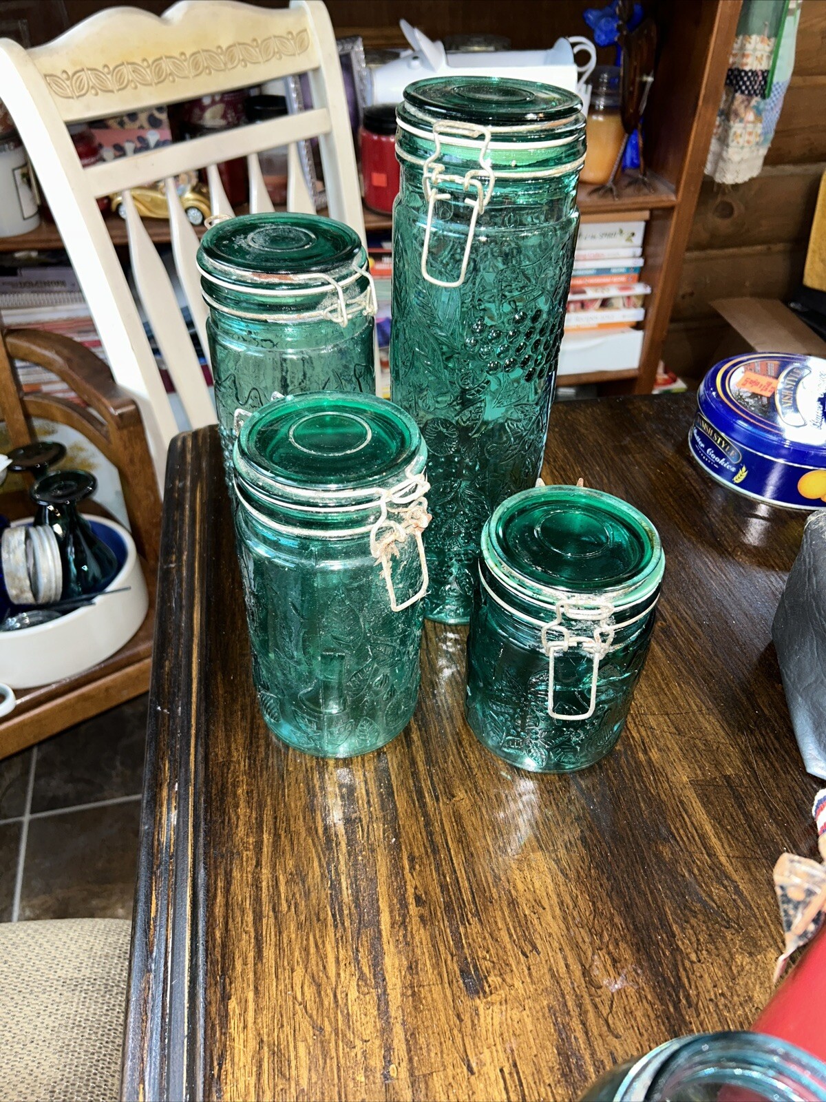 VINTAGE EMERALD GREEN GLASS CANISTER SET W/WIRE BAIL LID SET OF 4