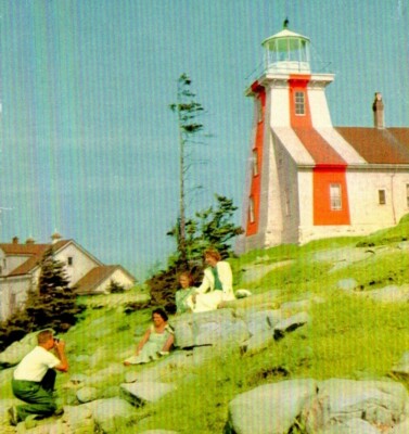 Point Prim Lighthouse Women Being Photographed on Rocks Digby PEI Canada BR-11
