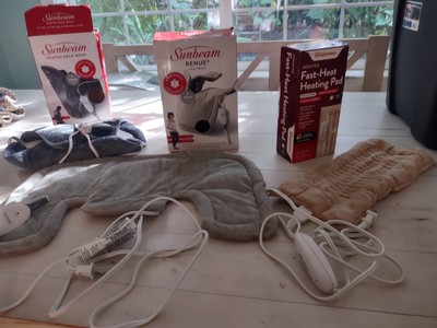 3 Heating Pads. Boxes Are Damaged. Product Only - No Boxes . Items Are New.