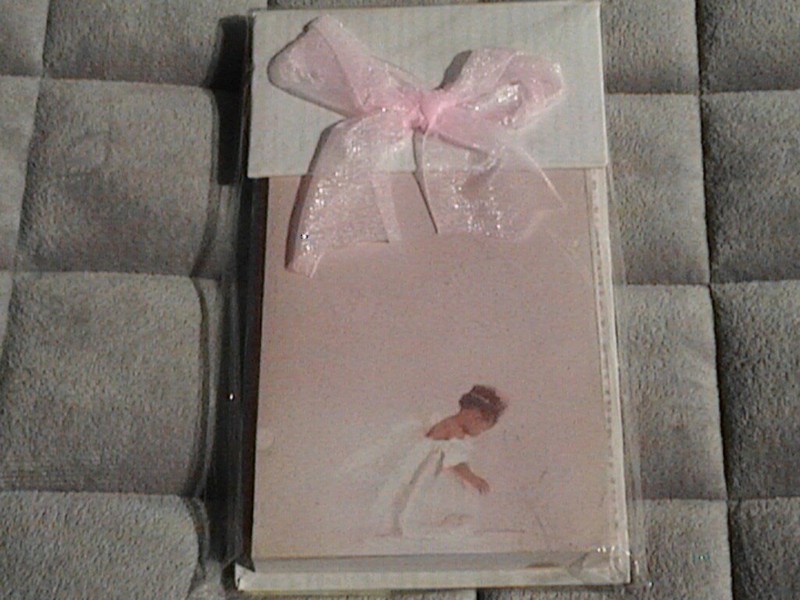 Betsy Cameron Pink Notepad/Stand with Bow. Girl kneeling on bottom of notepads