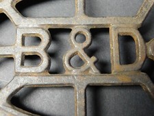 Cast Iron Footed Sad Iron Trivet - Advertising "B  D"