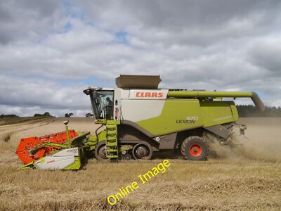 Photo 6x4 Claas Lexion 670 Lambden Nearing the corner of the field, this  c2014