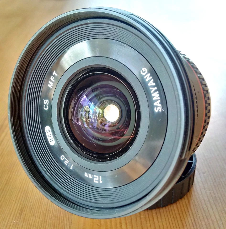 Samyang 12mm f/2 NCS CS Ultra Wide Manual Focus Camera Lens for MFT + Hood, Caps - Image 2 of 4