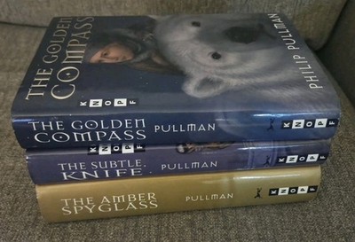 The Golden Compass, The Subtle Knife, and Amber Spy Glass