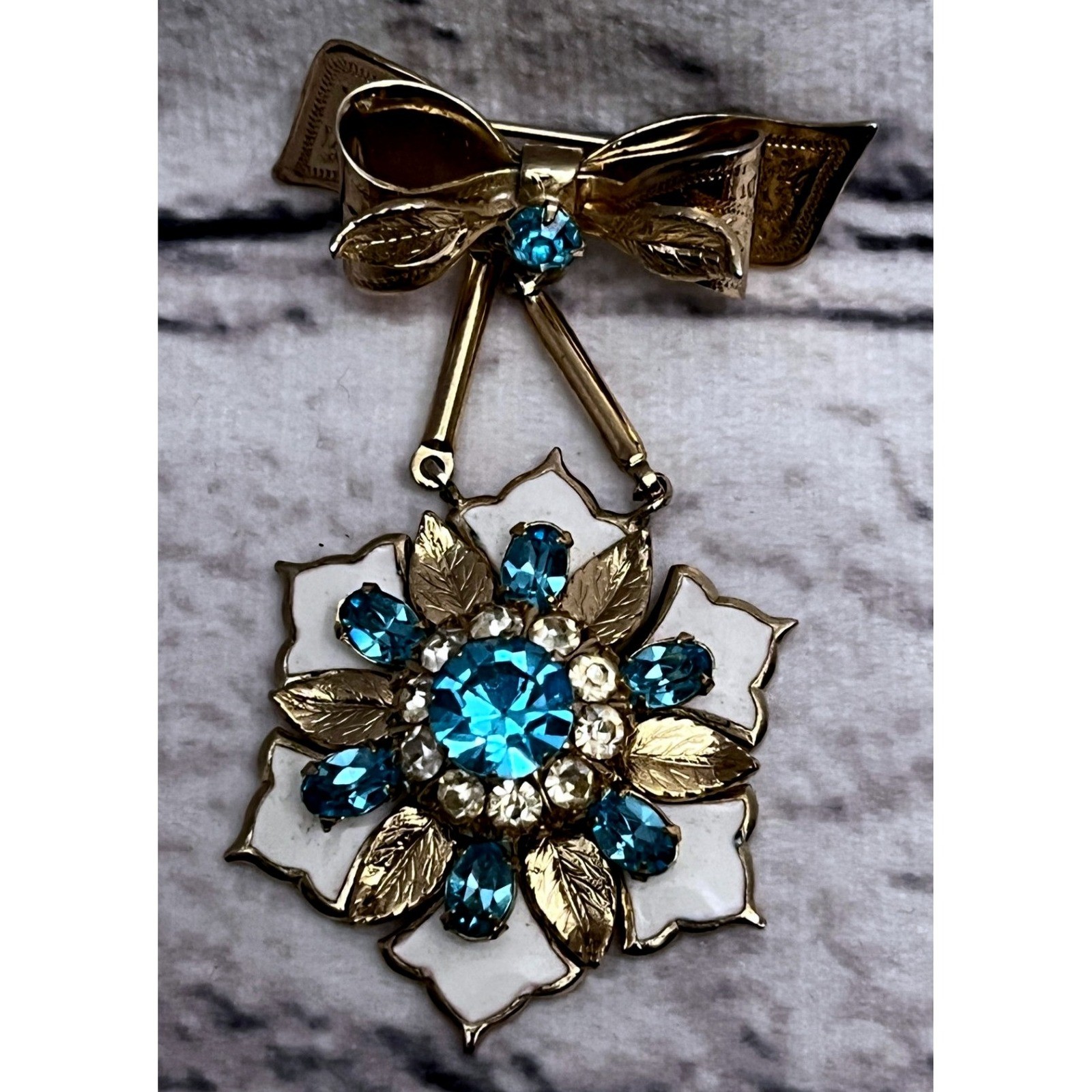 Vintage Coro Gold Tone Bow & Flower Brooch White Enamel and Blue Rhinestone