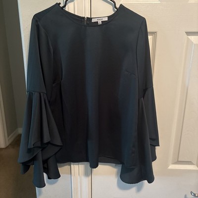 Ro & De rich burgundy blouse features dramatic, flared bell sleeves.