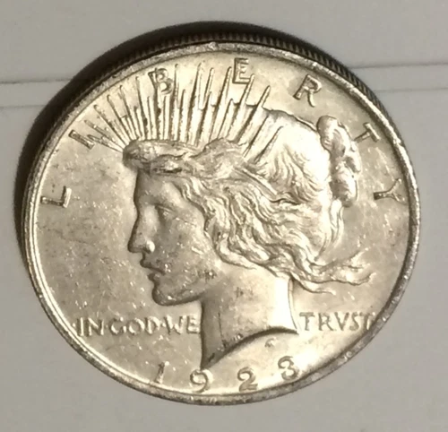 1923-P AU/BU Peace Silver Dollar, pictures are of the exact coin up for auction.