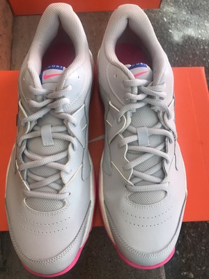grey nike shoes with pink swoosh
