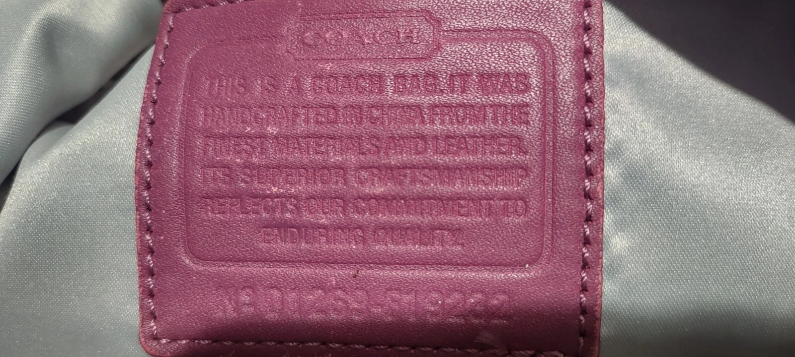 Borsa a tracolla Coach Penelope firmata viola.