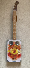 Cigar box guitar with logo