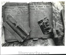 1988 Press Photo Football Player Emery Nix Holds State Champion Memorabilia
