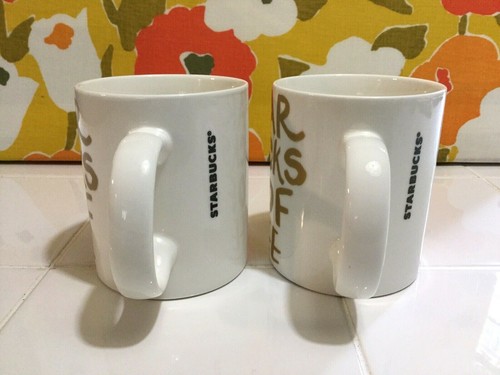Pair Starbucks 2015 Gold Grafitti Letters White Ceramic Coffee Mugs 12 oz NWOT - Picture 2 of 6