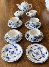 Antique Hand Painted Childs Tea Set. The Tea Set Is White  Blue Onion Pattern